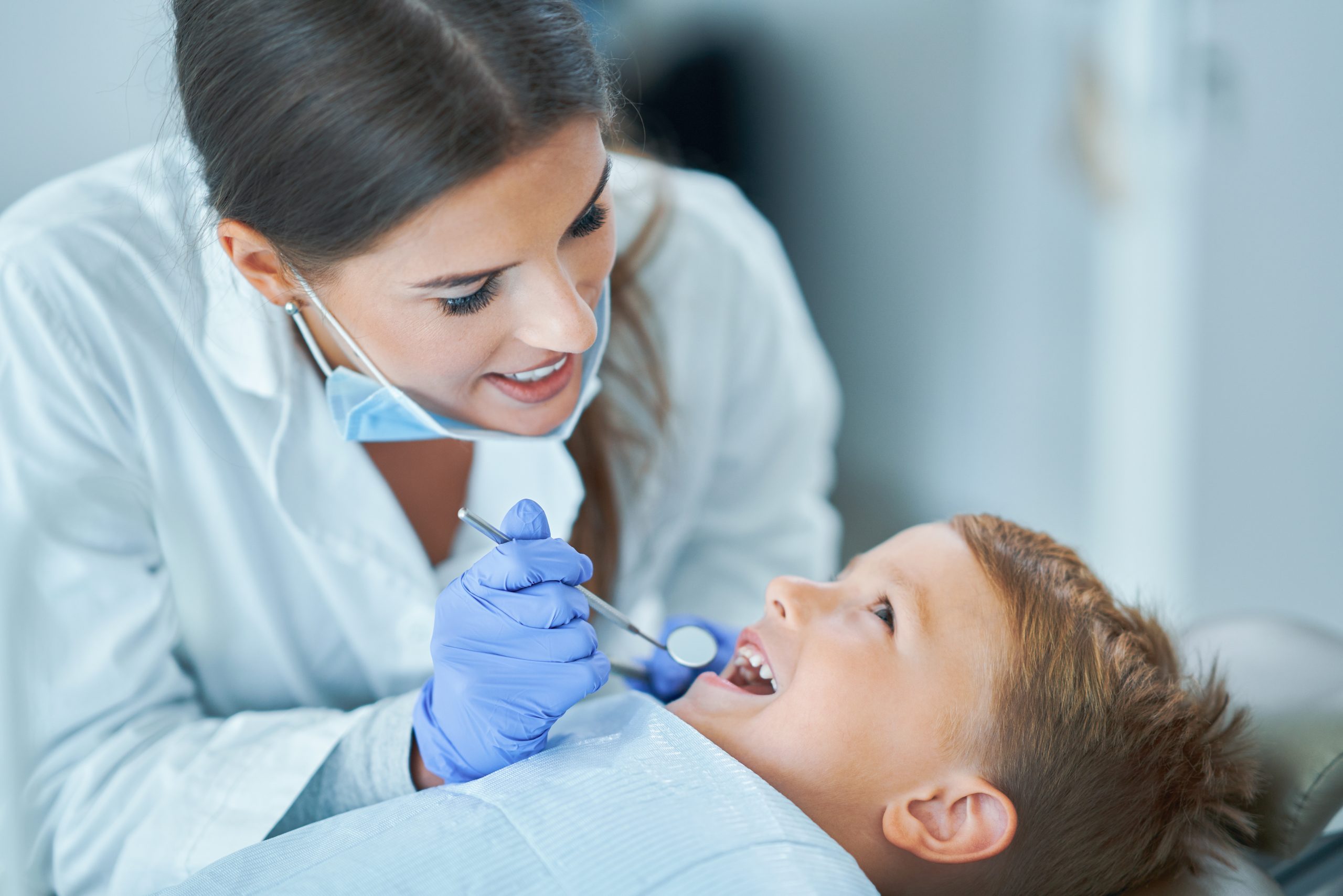 Little boy sitting in the dentists office